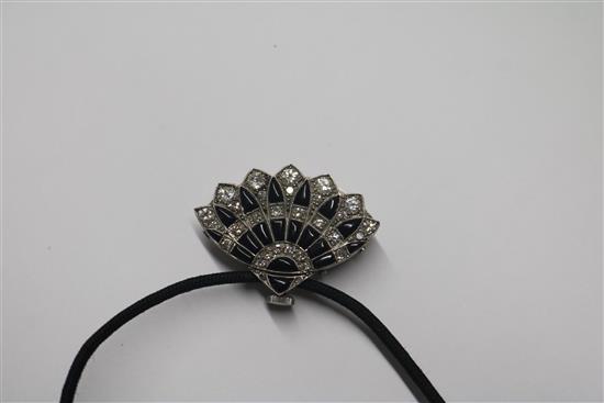 An Art Deco style white metal, diamond and black onyx set fan shaped pendant watch, on a fabric necklace, watch 30mm.